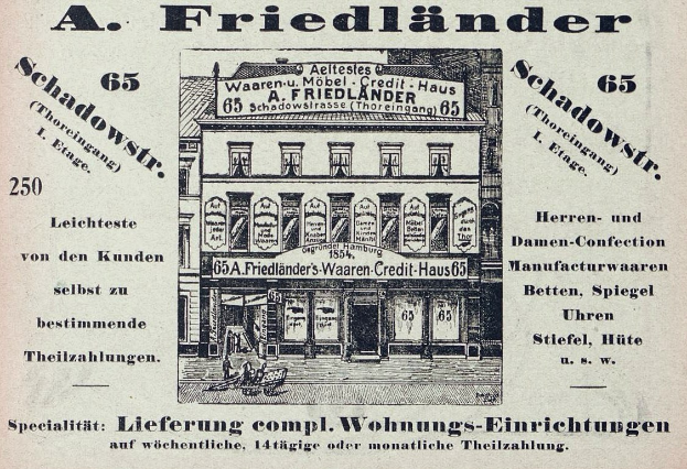 Schwarze und weiße Werbung für ein Friedländer Geschäft in Deutschland, das ein Gebäude mit Text an der Fassade zeigt.